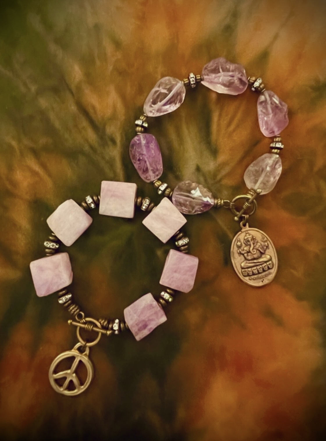Purple gemstone wrist candy with Ganesh and peace charms